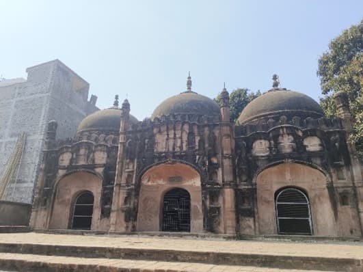 The three-domed mosque structure
